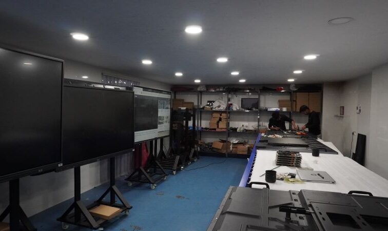 ALTOP finished goods staging and quality check area for Digital Podiums and IFP inventory.