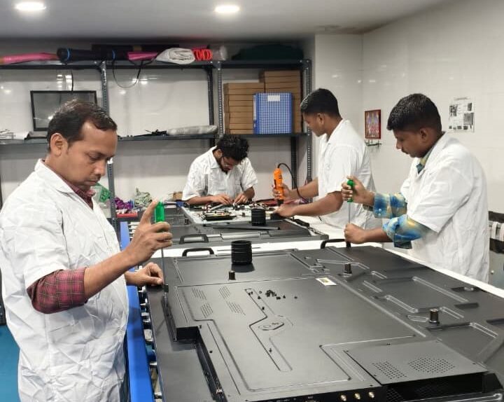 ALTOP Interactive Flat Panel (IFP) assembly line with technicians for smart classroom solutions.
